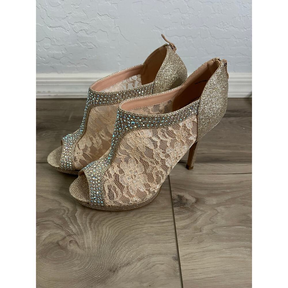 Women’s lace and rhinestone peep toe heels